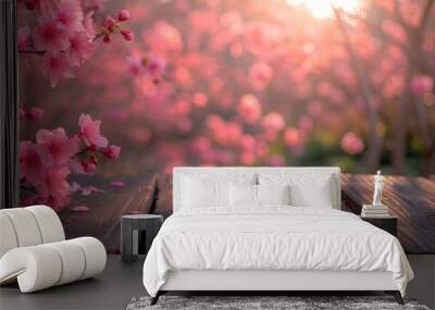 Empty wooden table in Sakura Flower Park with a sunny, blur garden background with a country outdoor theme. Template mockup for the display of the product. Wall mural