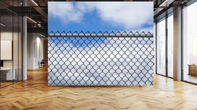 iron chainlink fence against sky Wall mural