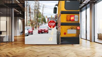 school bus with stop sign flashing on the street Wall mural