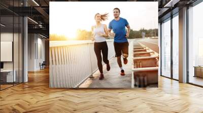 Active couple jogging Wall mural