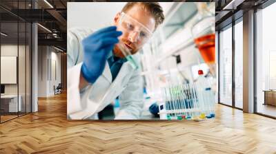 Attractive student of chemistry working in laboratory Wall mural