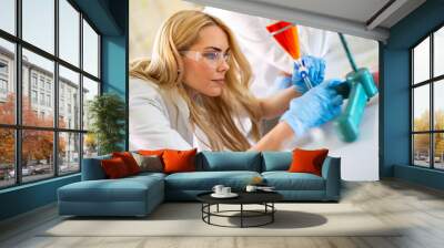 Attractive young woman scientist working in laboratory Wall mural