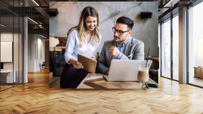 Beautiful business colleagues at meeting in modern office interior Wall mural