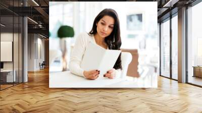 Beautiful woman looking at menu Wall mural