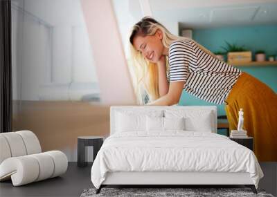 Beautiful young happy cheerful woman enjoying her time and freedom Wall mural