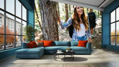 Beautiful young woman spending time in nature Wall mural