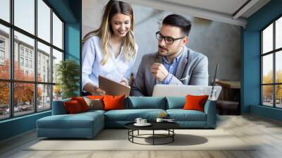 Business colleagues having conversation during coffee break Wall mural