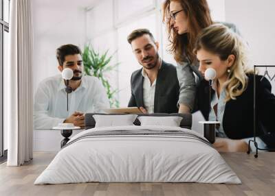 Business people working together on project and brainstorming in office Wall mural