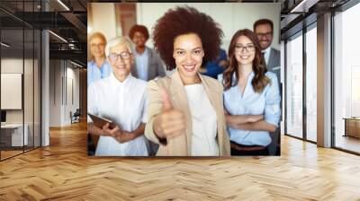 Business team celebrating a good job in the office Wall mural