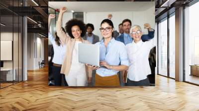 Business team celebrating a good job in the office Wall mural