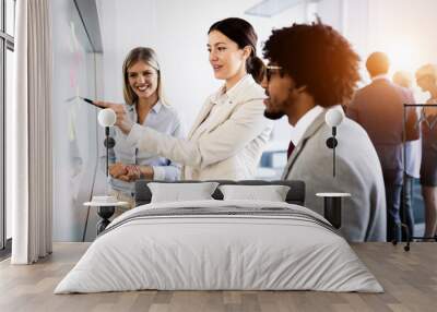 Businesspeople discussing together in conference room during meeting at office Wall mural