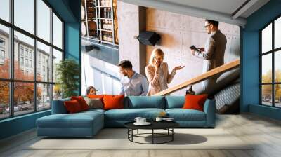 Busy business people on stairs in modern office Wall mural