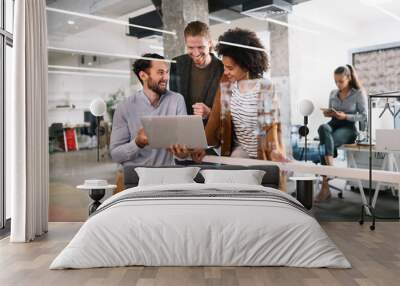 Cheerful coworkers in office during company meeting Wall mural