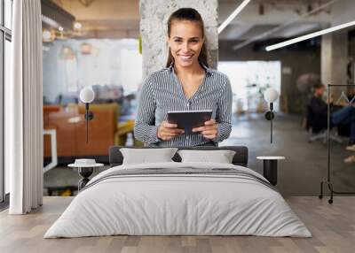 Close up portrait of a young business woman using digital tablet. Wall mural