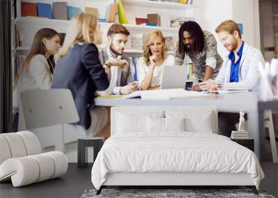 Colleagues brainstorming in office Wall mural