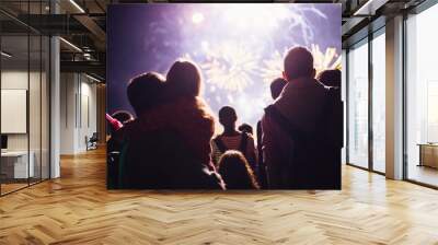 Crowd watching fireworks and celebrating new year eve Wall mural