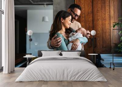 Family, parenthood and people concept. Happy young mother, father with new born baby at home Wall mural