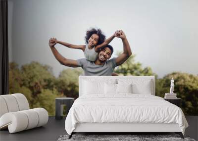 Father carrying daughter piggyback Wall mural