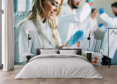 Female student of chemistry working in laboratory Wall mural