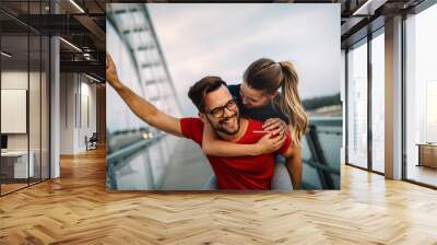 Fit happy couple having fun outdoor during exercise Wall mural