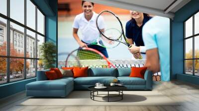 Fit happy poeple playing tennis together. Sport concept Wall mural