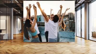 Fitness, sport, training and healthy lifestyle concept - group of happy people exercising outdoor Wall mural