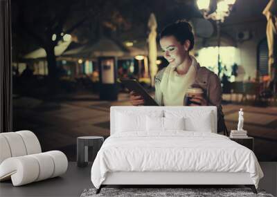 Girl using tablet at night Wall mural