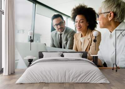 Group of business people working together, brainstorming in office Wall mural