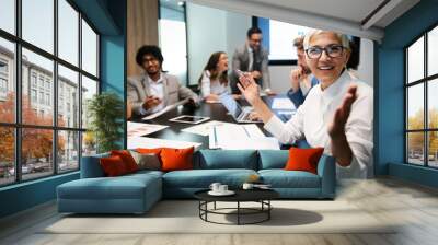 Group of business people working together, brainstorming in office Wall mural