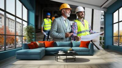 Group of construction engineer working in construction site Wall mural