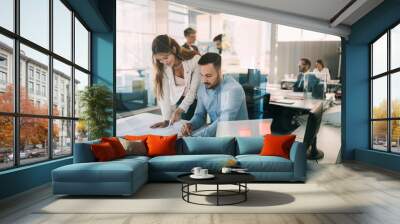 Group of coworkers working together on business project in modern office Wall mural