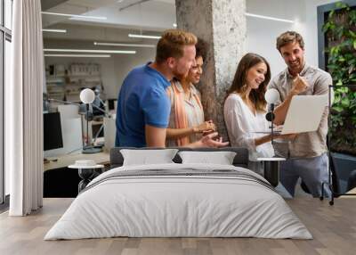 Group of happy business people discussing and working together during a meeting in office Wall mural