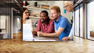 Group of happy business people working as a team at the office on meeting. Wall mural