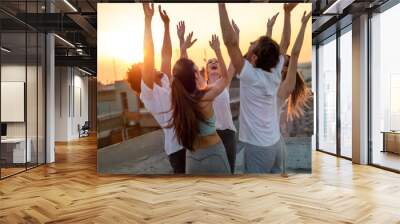 Group of happy fit friends exercising together outdoors. Sport people healthy lifestyle concept Wall mural