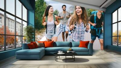 Group of happy friend traveler walking and having fun. Travel lifestyle and vacation concept Wall mural