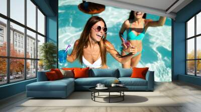 Group of happy friends having fun dancing at swimming pool outdoors Wall mural