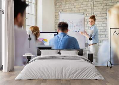 Group of happy multiethnic business people cooperating, working on meeting in corporate office Wall mural