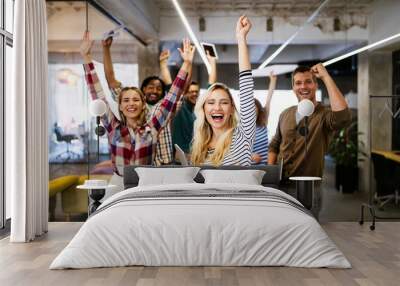 Group of successful happy business people in office celebrating profits Wall mural