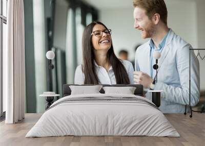 Happy business colleagues laughing together Wall mural