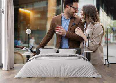 Happy business colleagues talking and walking in the city outdoor Wall mural