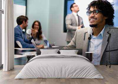 Happy business man with colleagues at a conference in office Wall mural