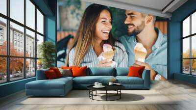 Happy couple having date and eating ice cream Wall mural