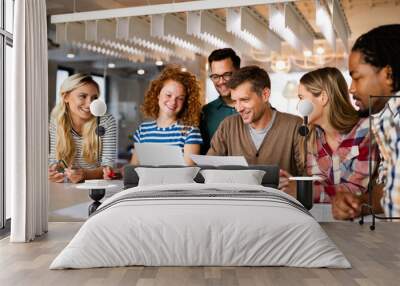 Happy creative designers, business people brainstorming in office Wall mural