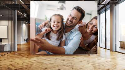 Happy family having fun time at home Wall mural