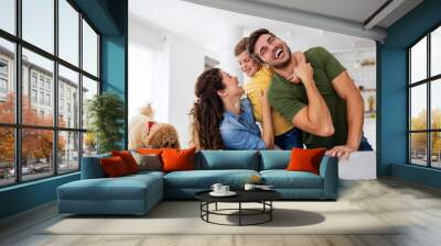 Happy family having fun time at home Wall mural