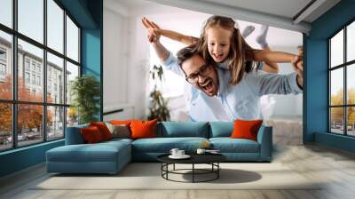 Happy family having fun time at home Wall mural