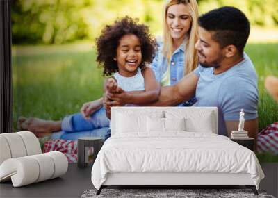 Happy family having fun time on picnic Wall mural