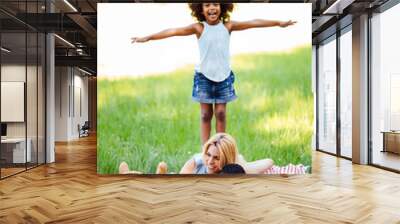 Happy family having fun time on picnic Wall mural