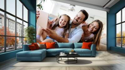 Happy family having fun times at home Wall mural