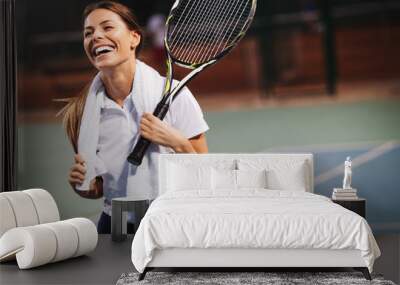 Happy fit girl playing tennis together. Sport concept Wall mural